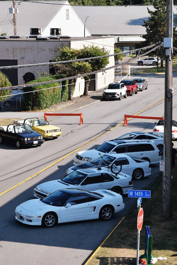 VIP parking along West 14th Street with show cars staged for the event